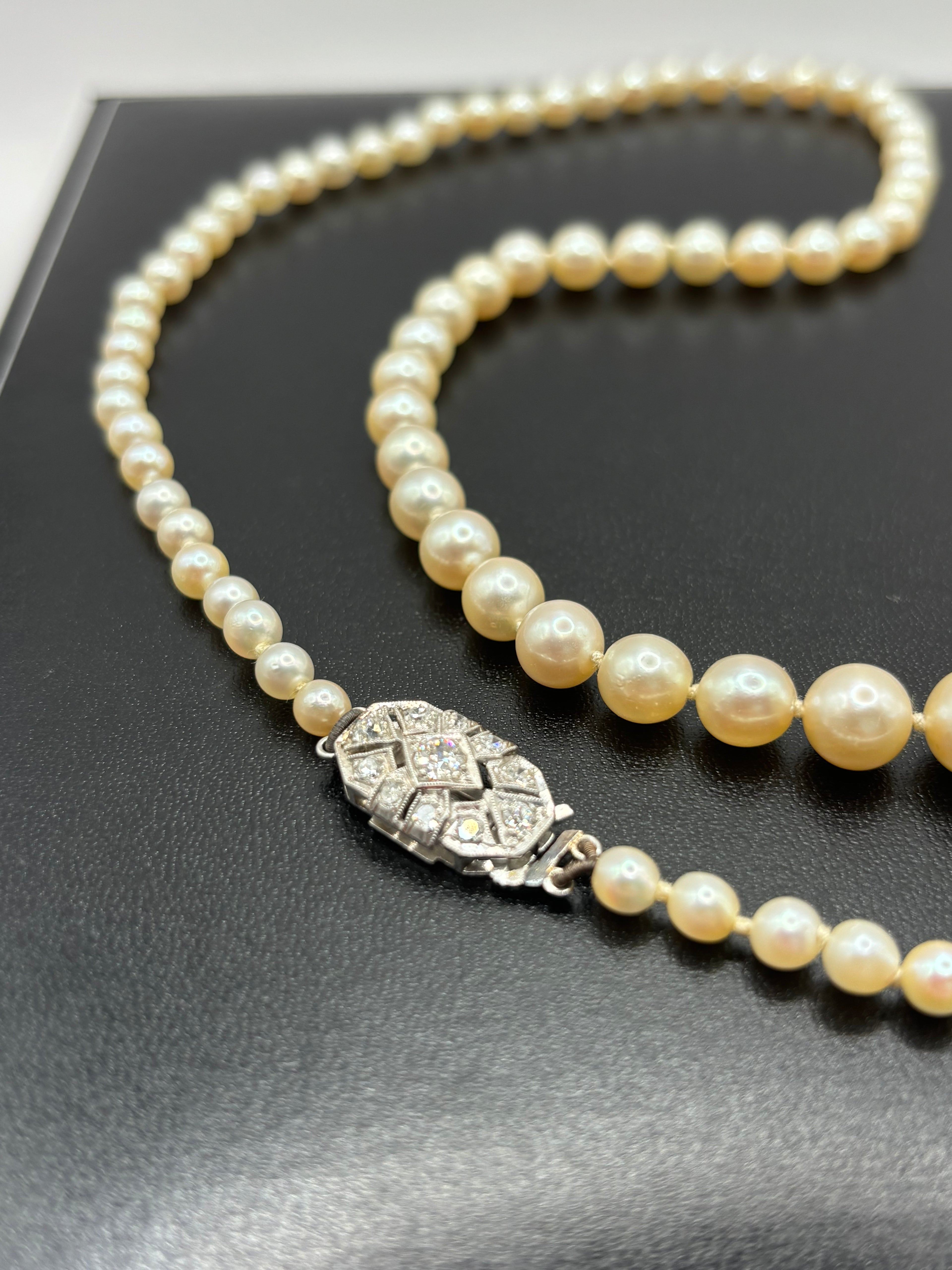 Art Deco Graduated Akoya Pearl Necklace with Diamond Platinum Clasp, circa 1925