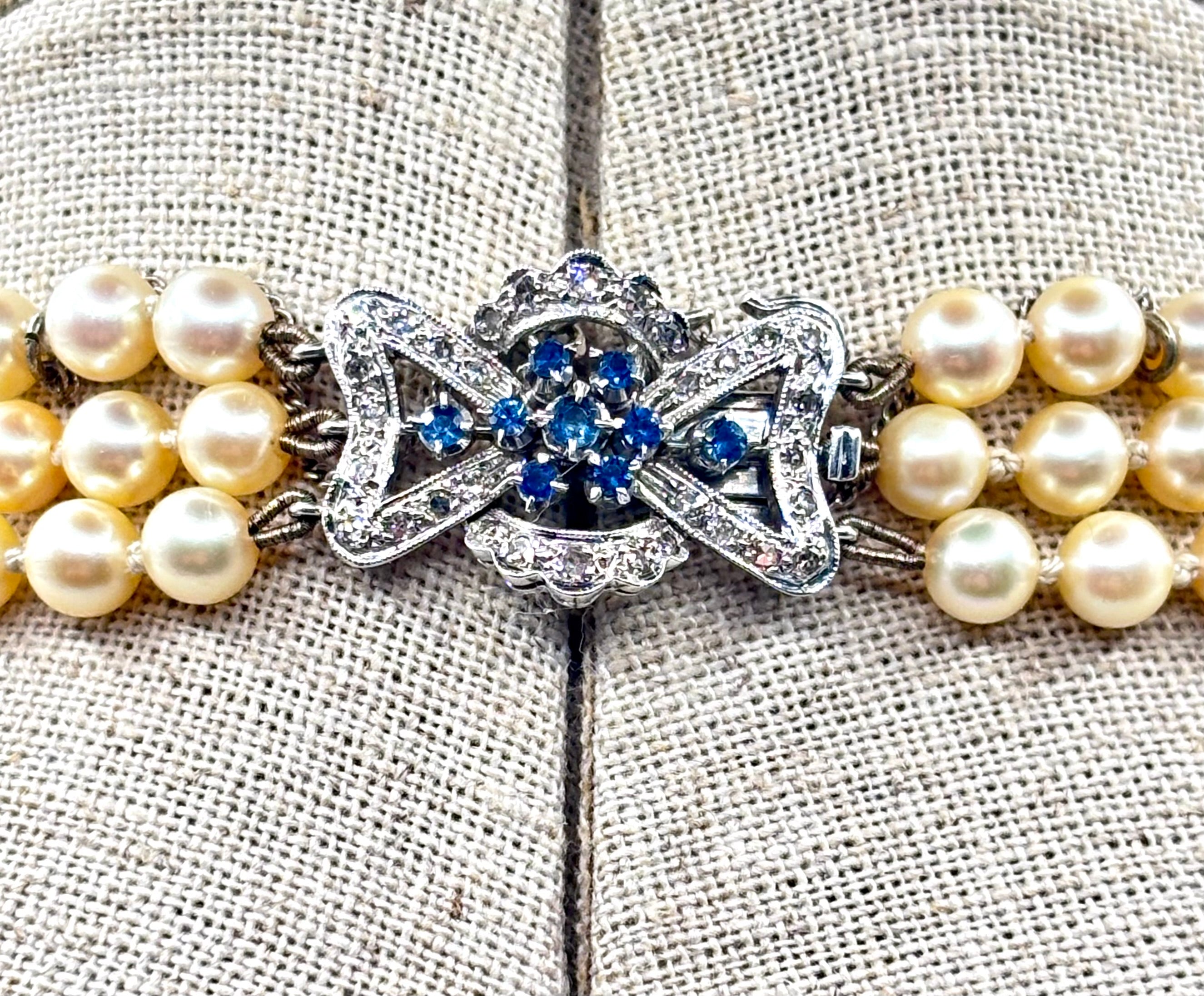 Vintage Triple-Strand Cultured Akoya Pearl Necklace 18K Carat Diamond Sapphire Bow Clasp, Circa 1960’s
