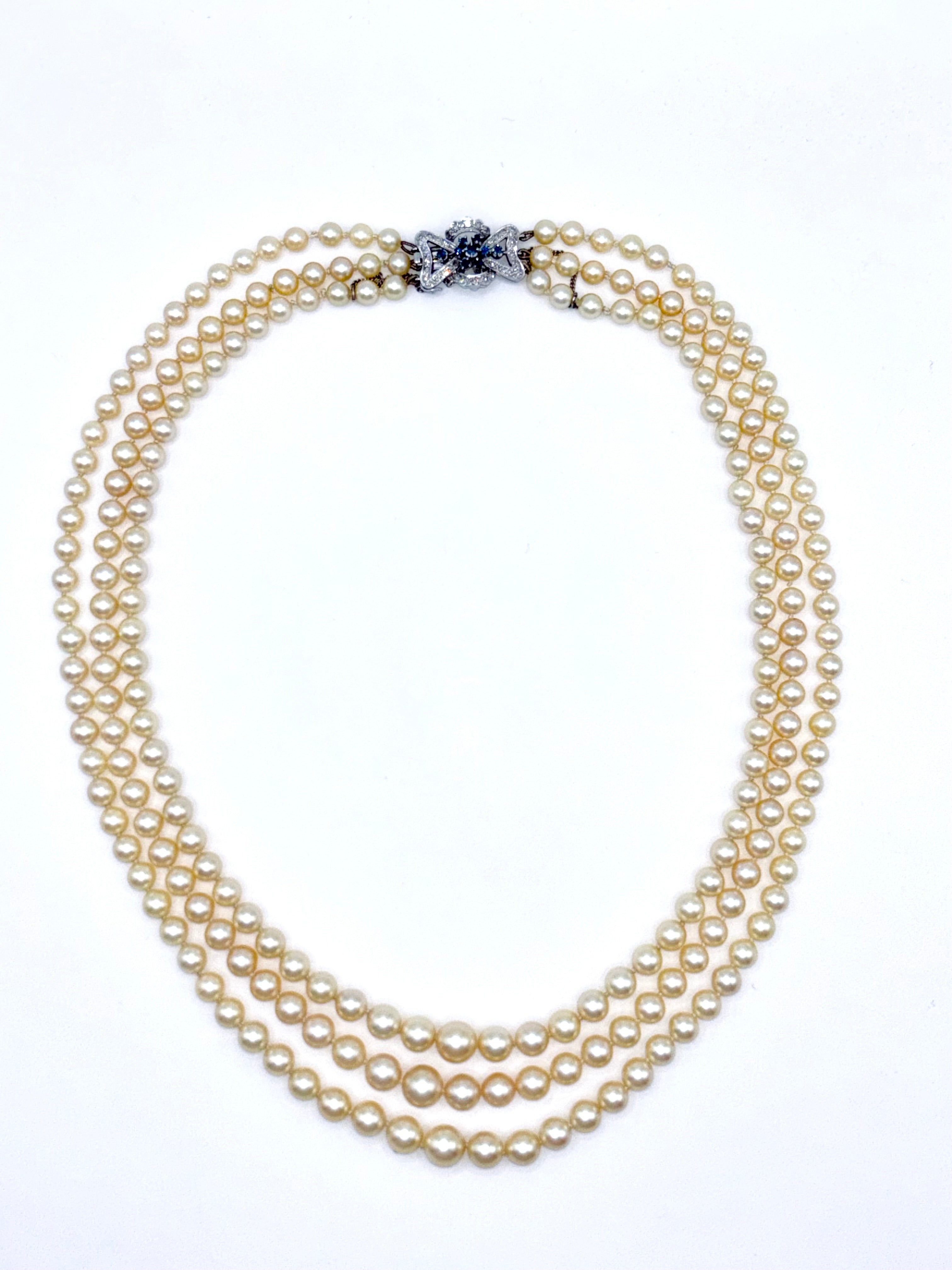 Vintage Triple-Strand Cultured Akoya Pearl Necklace 18K Carat Diamond Sapphire Bow Clasp, Circa 1960’s