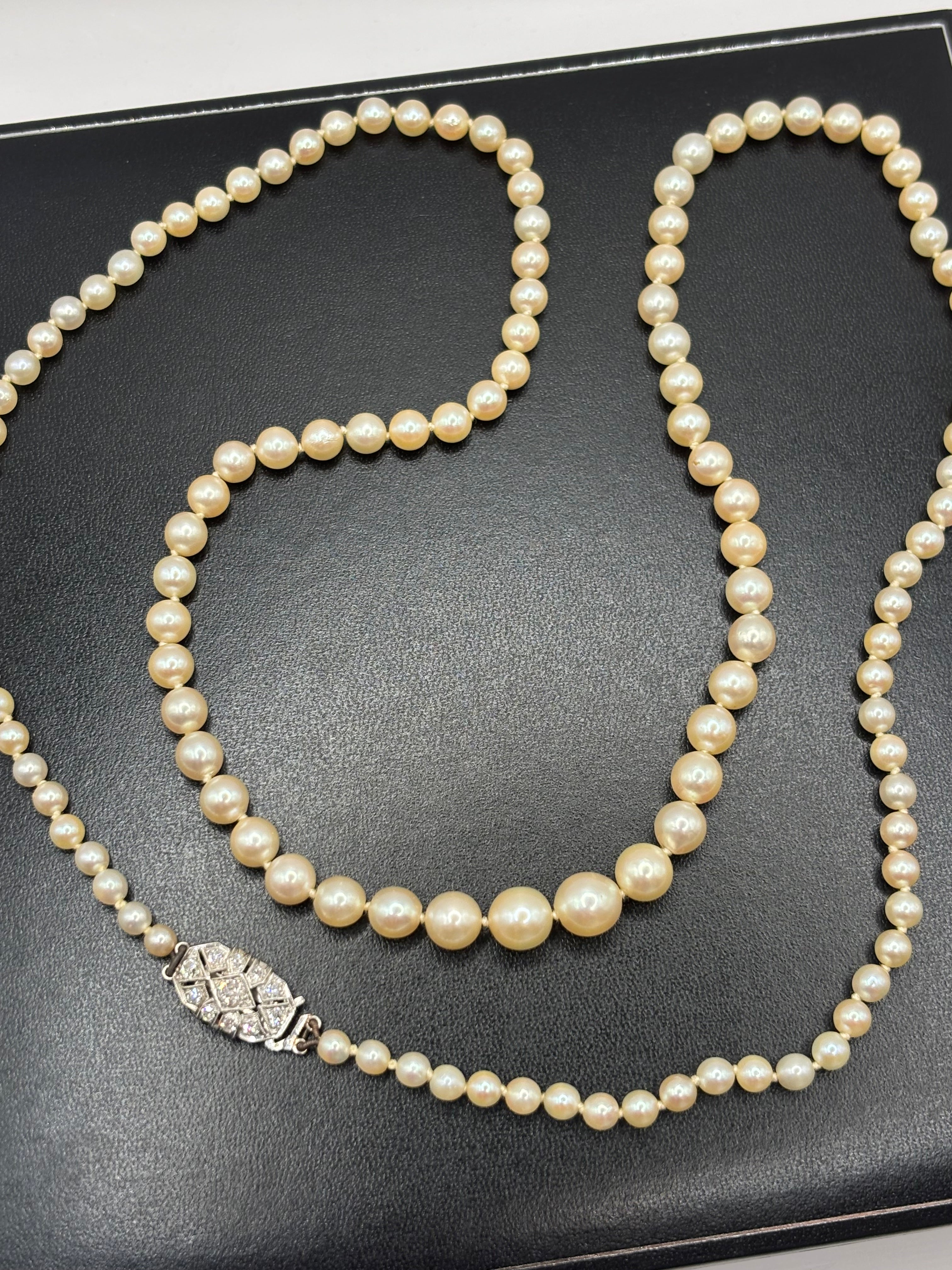 Art Deco Graduated Akoya Pearl Necklace with Diamond Platinum Clasp, circa 1925