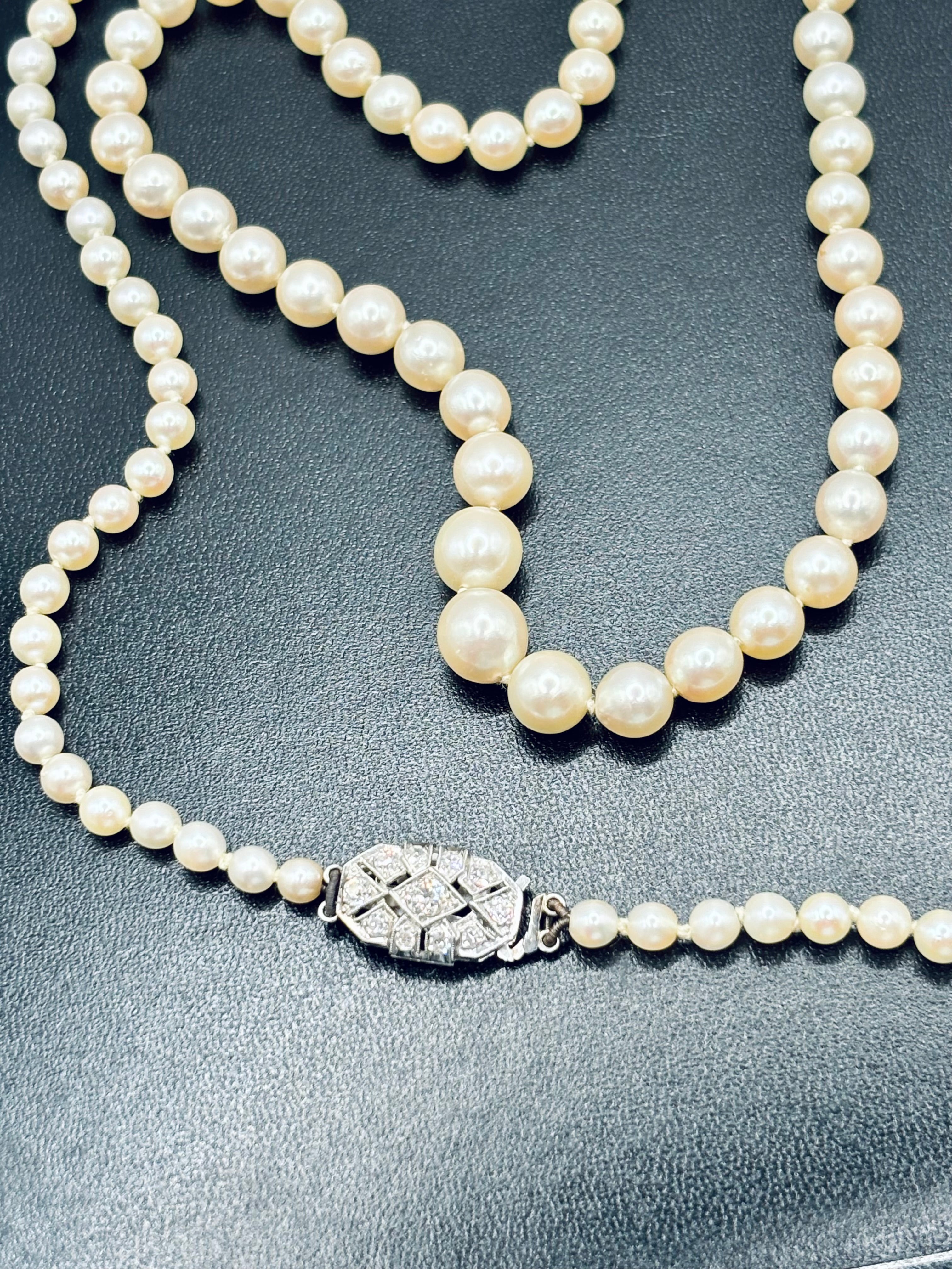 Art Deco Graduated Akoya Pearl Necklace with Diamond Platinum Clasp, circa 1925