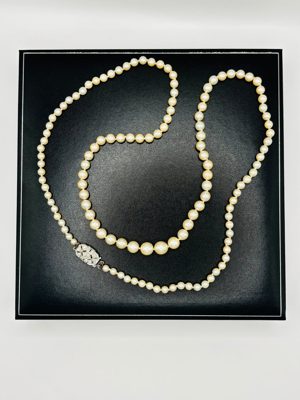 Art Deco Graduated Akoya Pearl Necklace with Diamond Platinum Clasp, circa 1925