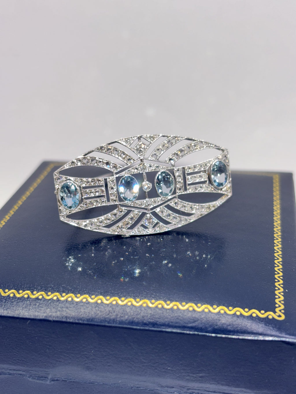 ART DECO PLATINUM, 18K Gold, Diamonds and Aquamarines Brooch c1920’s