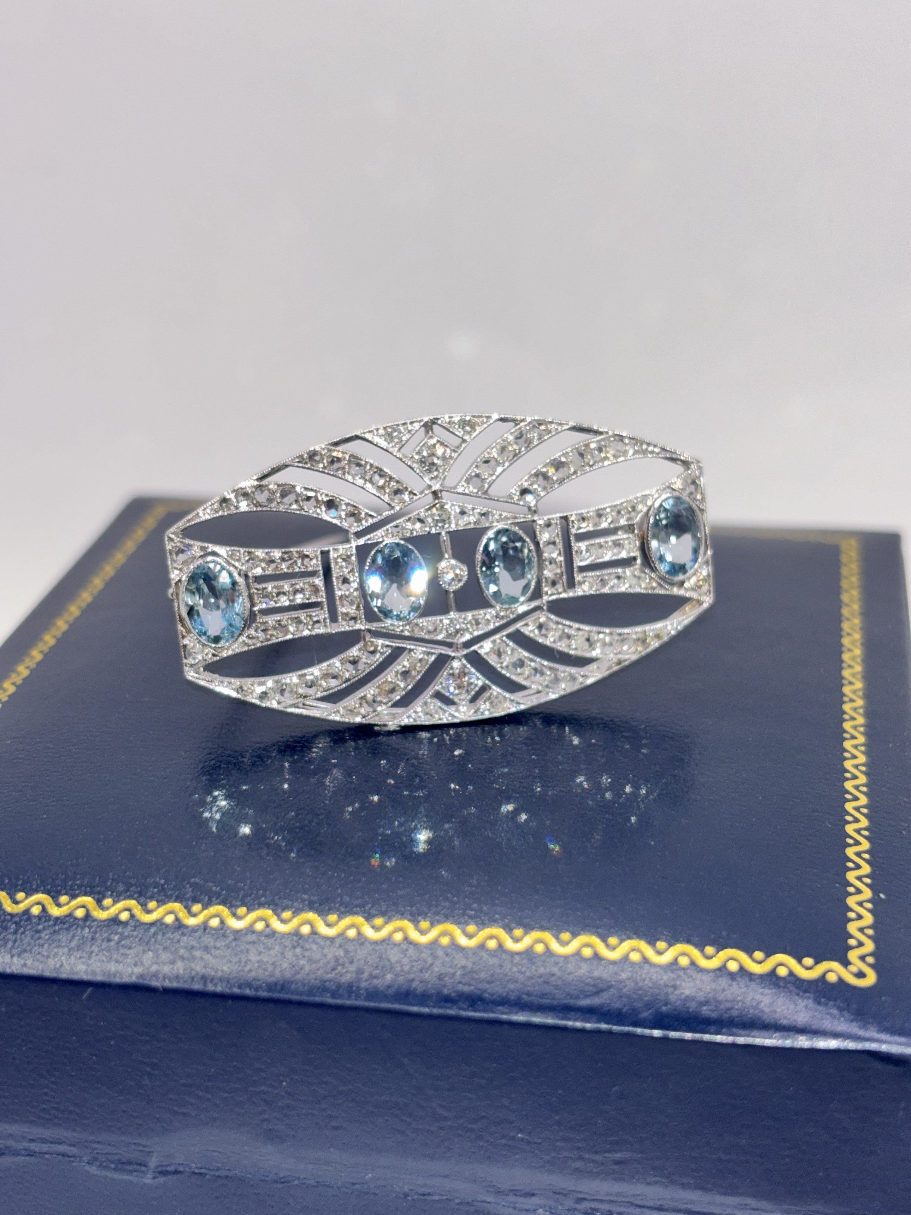 ART DECO PLATINUM, 18K Gold, Diamonds and Aquamarines Brooch c1920’s